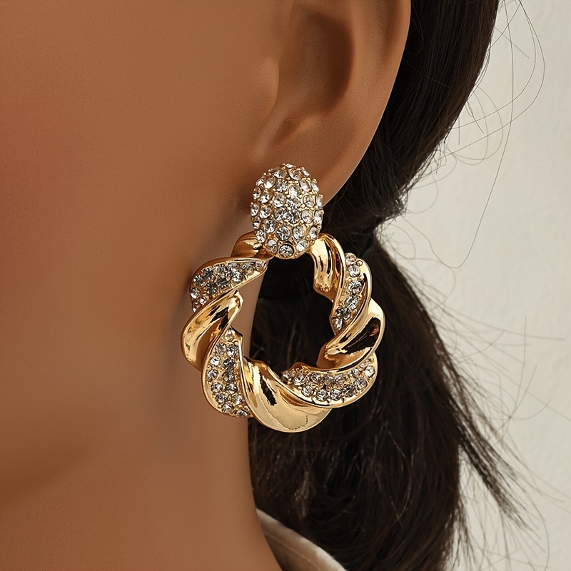 Hollow Twisted Pattern Dangle Earrings with Rhinestone Inlay